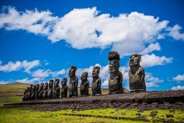 Man-shaped stone figures lined up in front of the horizon