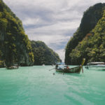 Thai boat navigating between islands