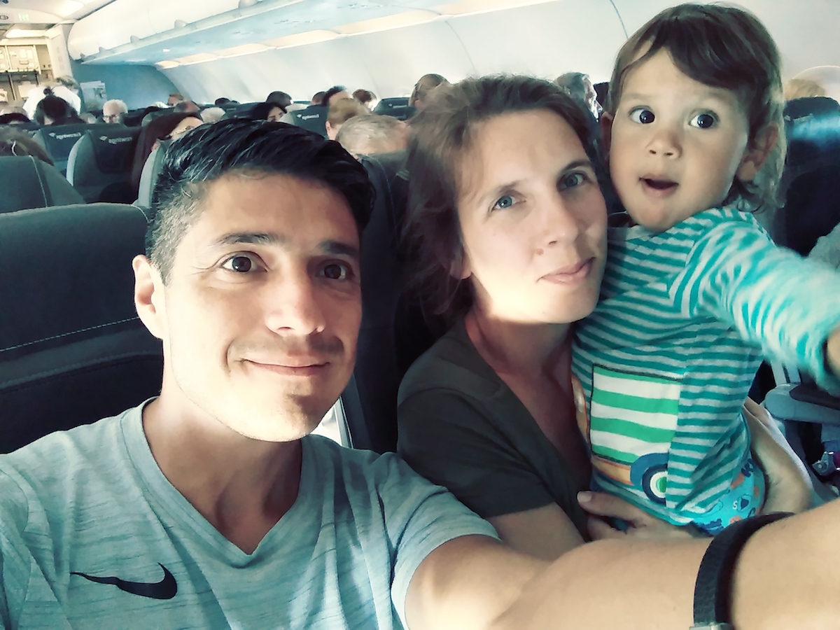 Father, mother and their son in an airplane.